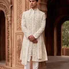 Menswear, in my view, should be about quiet confidence and impeccable detail. This ivory sherwani set is a masterclass in understated elegance, featuring intricate hand-embroidery that adds texture and depth without overwhelming the clean, tailored lines. It is perfect for the groom who values refined craftsmanship.