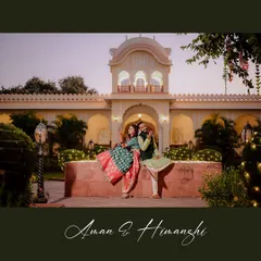 A playful and romantic shot from the Mehendi ceremony in Orchha. The bride showing off her lehenga while sitting with her groom captures the happy and relaxed vibe of the day.