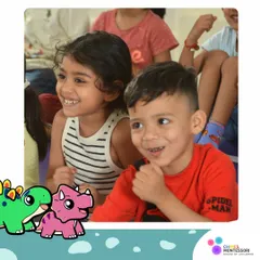 The smiles on our children's faces are the best measure of our success. These two friends share a moment of joy during a group activity.