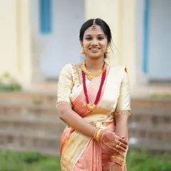 Here, I created a fresh and simple look for Chandana attending her sister's engagement. The makeup is subtle, with a focus on clean skin and a bright smile, paired with a classic silk saree.