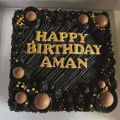 A classic square chocolate brownie cake, personalized for Aman's birthday. I use rich, dark chocolate frosting and can add custom messages in elegant lettering to make your celebration cake truly personal. This is one of my most popular eggless birthday cakes.