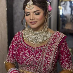 A soft and radiant bridal look for a day wedding. We used warm, shimmery tones on the eyes and a natural pink lip to create a fresh and timeless feel that enhances the bride's features beautifully.