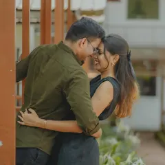 An intimate embrace, capturing the quiet connection and happiness between a couple. The framing adds a sense of privacy to the moment.