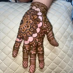 The full view of the mandala design, with detailed finger work and a simple wrist cuff.