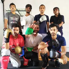 The weekend warriors after a kickboxing class. We have a diverse group of people, all united by their passion for martial arts.