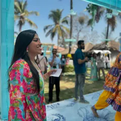 In my element, hosting an outdoor Mehendi ceremony. With cue cards in hand, I guide the flow of events, making sure performances and rituals run smoothly while keeping the guests entertained.