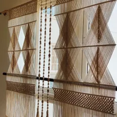 This is one of the most challenging and rewarding pieces I've ever made. It's a large macrame partition, designed with a precise geometric diamond pattern to divide a living space while keeping it bright and airy. Creating such a large, intricate piece required so much focus, but seeing it transform a room makes all the effort worthwhile.