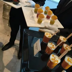 Trays of our popular dessert shots. This image shows our creamy Mango Rabdi Shots alongside our innovative Pani Puri Shooters, offering guests a unique sweet and savory experience.