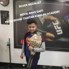 Silver medalist Mohd Anas Saifi. Another champion from my academy, holding his hard-earned championship belt. We train fighters who are ready for any competition.