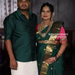 A beautiful couple portrait from their baby shower event. The mom-to-be is wearing a classic temple jewellery set.