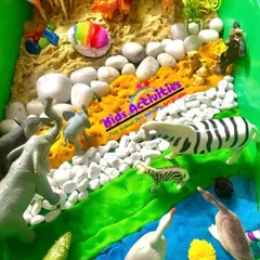 This is a snapshot of one of our sensory bins, a core part of our learning process. Here, children explore a miniature jungle world with different textures like sand, stones, and water. This kind of sensory play is vital for developing cognitive, social, and fine motor skills in a calm and engaging way.
