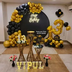 For a stylish teen or adult party, I designed this black and gold theme for a 13th birthday. It features a round black backdrop, a neon "Happy Birthday" sign, a dramatic balloon arch, and matching gold plinths and marquee numbers.