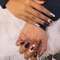 A trendy and edgy design for those who love a darker aesthetic. This set features hand-painted stars and abstract patterns in a rich brown, black, and cream color palette.