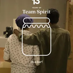 Team spirit is what holds us together. This image of two team members captures the trust and collaboration that is at the core of our work family.