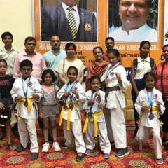 A group of my students and their families after a successful tournament. The support of parents is crucial, and we celebrate these achievements as a community.