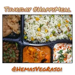 A look at our Thursday Happy Meal with a flavorful corn and pea pulao, creamy veg Kolhapuri, black chana masala, and sweet atte ka sheera.