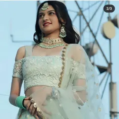 This client looks fresh and modern in a light blue lehenga paired with a matching mint green meenakari choker set. It's a perfect look for a daytime wedding or Mehendi ceremony.