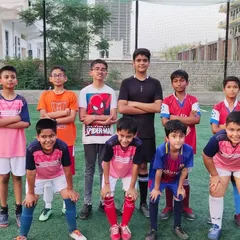One team, one YDFA. A group of our players posing for a team photo, showcasing the unity and friendship that we build at our academy.