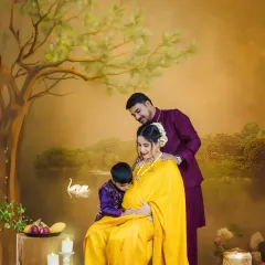 A beautiful family portrait in our Ravi Varma artistic style. The father and older brother lovingly interact with the baby bump, creating a timeless and painterly image.