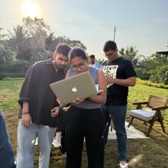 The on-set review is a crucial part of the process. Here, the team and I are checking the images on a laptop to make sure we are aligned with the client's vision.