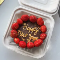 Happy New Year! A chocolate bento cake decorated with fresh strawberries and gold dust to ring in the new year.