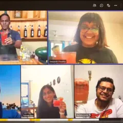 A screenshot from another successful online class. Everyone is proudly holding up their finished red cocktails, all made together from our respective homes.