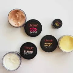 This is a beautiful flat lay of some of my most-loved products, showing their rich textures. You can see the creamy Rose Clay Face Mask, the light Fleur Body Butter, the rich Plush Face Cream, and the smooth Irish Cream Lip Balm. Each one is handcrafted with care.