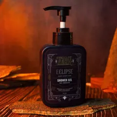 A close-up of the shower gel bottle, with dramatic orange and blue lighting. This highlights the product's label and design while creating a powerful visual.