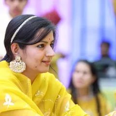 A sister's Haldi ceremony is a special moment. I designed this elegant sheesh phool and large chandbali earring set in white kundan to perfectly complement the vibrant yellow theme of the function.