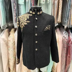 A full view of the black Jodhpuri suit with gold leaf embroidery. This is a classic, regal choice for weddings and formal ethnic events.