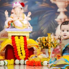 A curious glance from our little devotee. This shot captures a quiet, candid moment amidst the vibrant colors of the Ganpati festival theme.