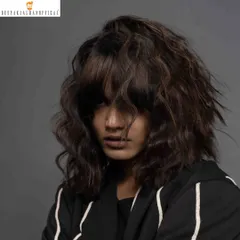 This look is all about hair texture. Created for a Schwarzkopf Professional shoot, this style features messy, lived-in waves and a heavy fringe, giving it a modern and edgy feel.