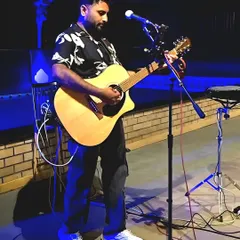 Focused on the music during a live gig. Every show gets my full attention, whether it's for a small cafe or a large festival.