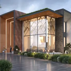 This farmhouse in Chattarpur features a dramatic double-height glass atrium that serves as the centerpiece of the design. The combination of stone, wood, and glass creates a sophisticated and modern aesthetic that blurs the line between the interior and the surrounding landscape.