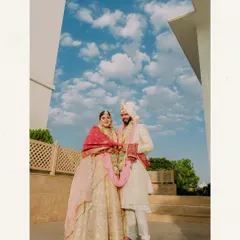 An epic portrait for an epic celebration in Udaipur. We use the grandeur of destination wedding locations to frame our couples, creating stunning, memorable images against dramatic skies and architecture.