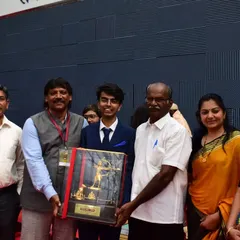 Our founder and coach with our Ekalavya award-winning shooter Srijay and his family, holding the prestigious trophy.