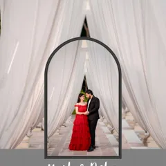 Framed in love. I used an archway of white curtains to create a natural frame for the couple, drawing the eye to their intimate connection and the stunning detail of the bride's red gown.