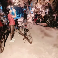 A rider stops to take a photo on a quiet Indiranagar street. Our rides are about capturing moments, sharing stories, and reclaiming our liberty to explore the city at night, safely as a community.