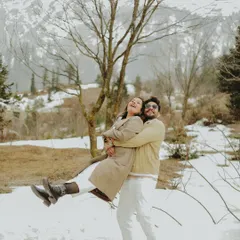Pure, unadulterated joy in this playful lift during a post-wedding shoot in the snow.