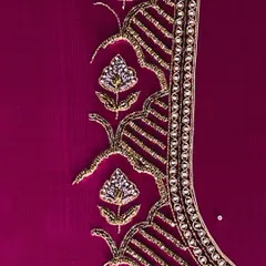 A detail of the zari and beadwork on a magenta blouse, showcasing the floral and traditional motifs that I love to incorporate into my designs.