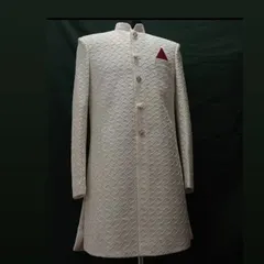 A classic off-white sherwani, perfect for a groom. I focus on getting the details right, from the intricate self-patterned fabric to the structured, clean tailoring that guarantees a royal look.