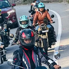 A line of our riders navigating a winding road. Riding in a group is an amazing experience, and we teach you the skills to do it safely and confidently.
