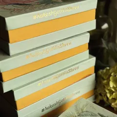 A stack of our custom wedding favor boxes, each one foil stamped with the couple's unique hashtag, #AakashGotHisSheen. We love adding these personal details to make your wedding gifts truly one of a kind.