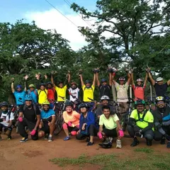 A mandatory group photo from our ride through the Nallur Tamarind Grove. Exploring these green trails is what our off-road cycling adventures are all about.