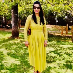 Our client Devika spreading some summer cheer in a custom yellow lace and chiffon dress with a pleated skirt.