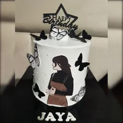 Another take on the trendy silhouette cake, this design features a different illustration and a mix of black and monochrome butterflies. It's a chic and artistic choice for a stylish woman's birthday.
