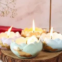 A beautiful arrangement of our pastel Scented Lotus Jars. Each jar is hand-finished with gold leaf, making them a perfect decorative accent or a thoughtful festive gift.