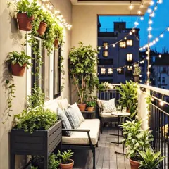 We transformed this compact city balcony into a cozy, magical retreat. With smart use of vertical space, comfortable seating, and warm string lights, even the smallest area can become your favorite spot to unwind.