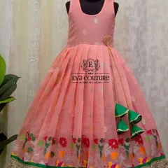A lovely sleeveless frock in pink organza. The skirt has a colorful border with bird motifs, and the dress is finished with playful green tassels.