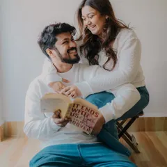 A perfect example of a relaxed, candid pre-wedding session. Just a couple sharing a book and a laugh at home. My goal is to make you feel comfortable enough to be yourselves, so I can capture the small, real moments that define your relationship.